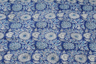 Indigo Chrysanthemum Heritage hand block printed cotton fabric featuring blue and ivory floral motifs on a rich indigo background