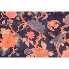 Close-up of floral print with blue leaves on deep blue hand-printed cotton velvet