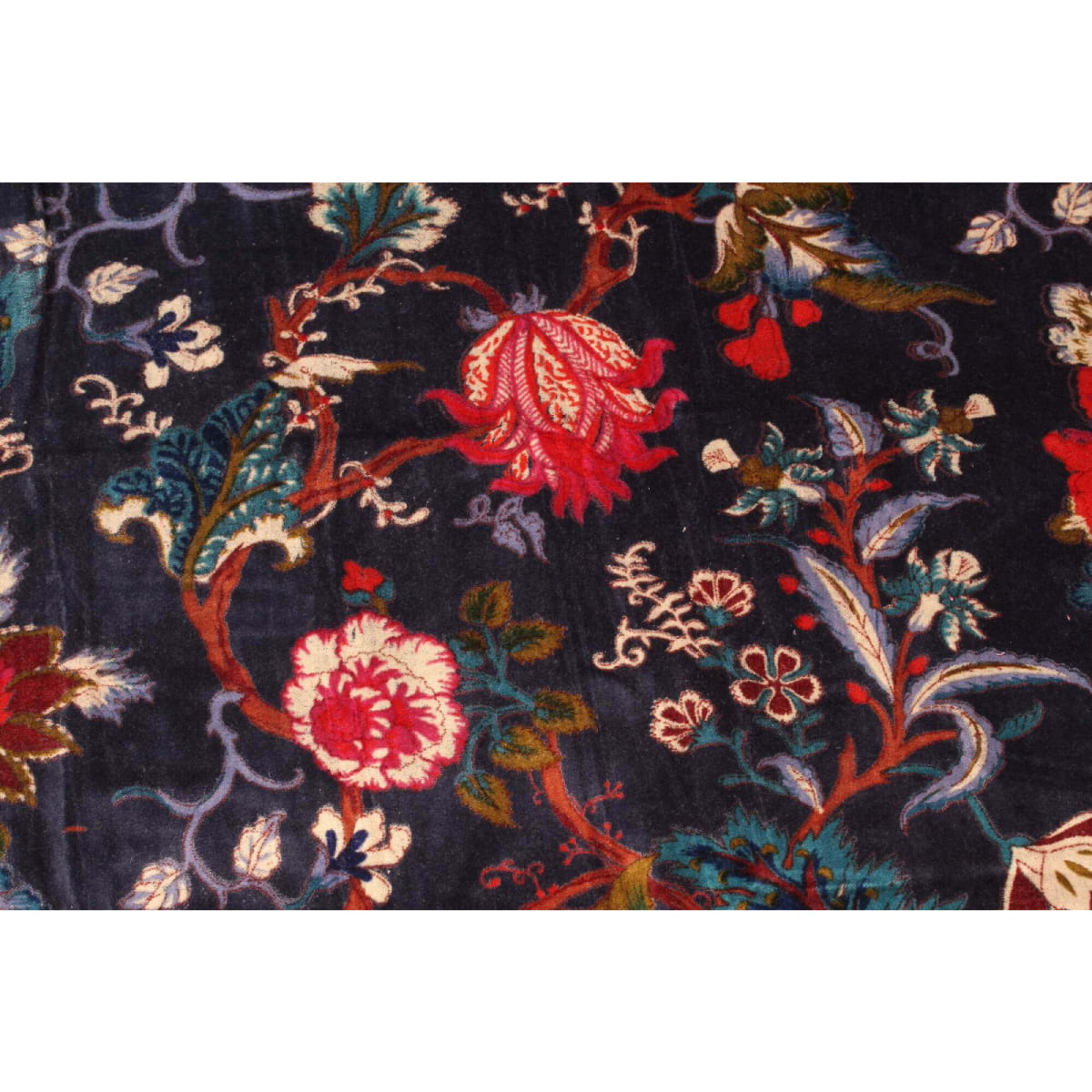 Close-up of floral print on dark blue hand-printed cotton velvet