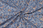 Hand block printed cotton fabric draped to show floral pattern, texture and fabric movement