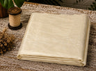 Ivory Dupion Silk Fabric folded to showcase its soft ivory colour, natural silk texture, and elegant lustrous sheen