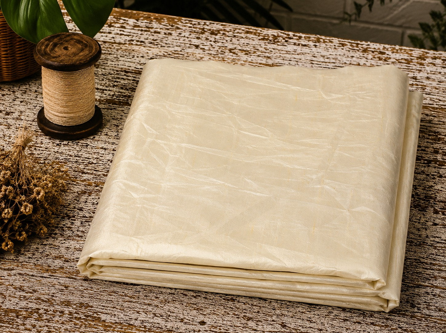Ivory Dupion Silk Fabric folded to showcase its soft ivory colour, natural silk texture, and elegant lustrous sheen