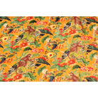 Mustard cotton velvet with monkey and colorful foliage – flatlay view