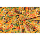 Folded mustard velvet showing lush foliage and animal print