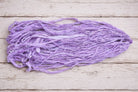 Lavender sari silk ribbon showing natural texture and frayed edges