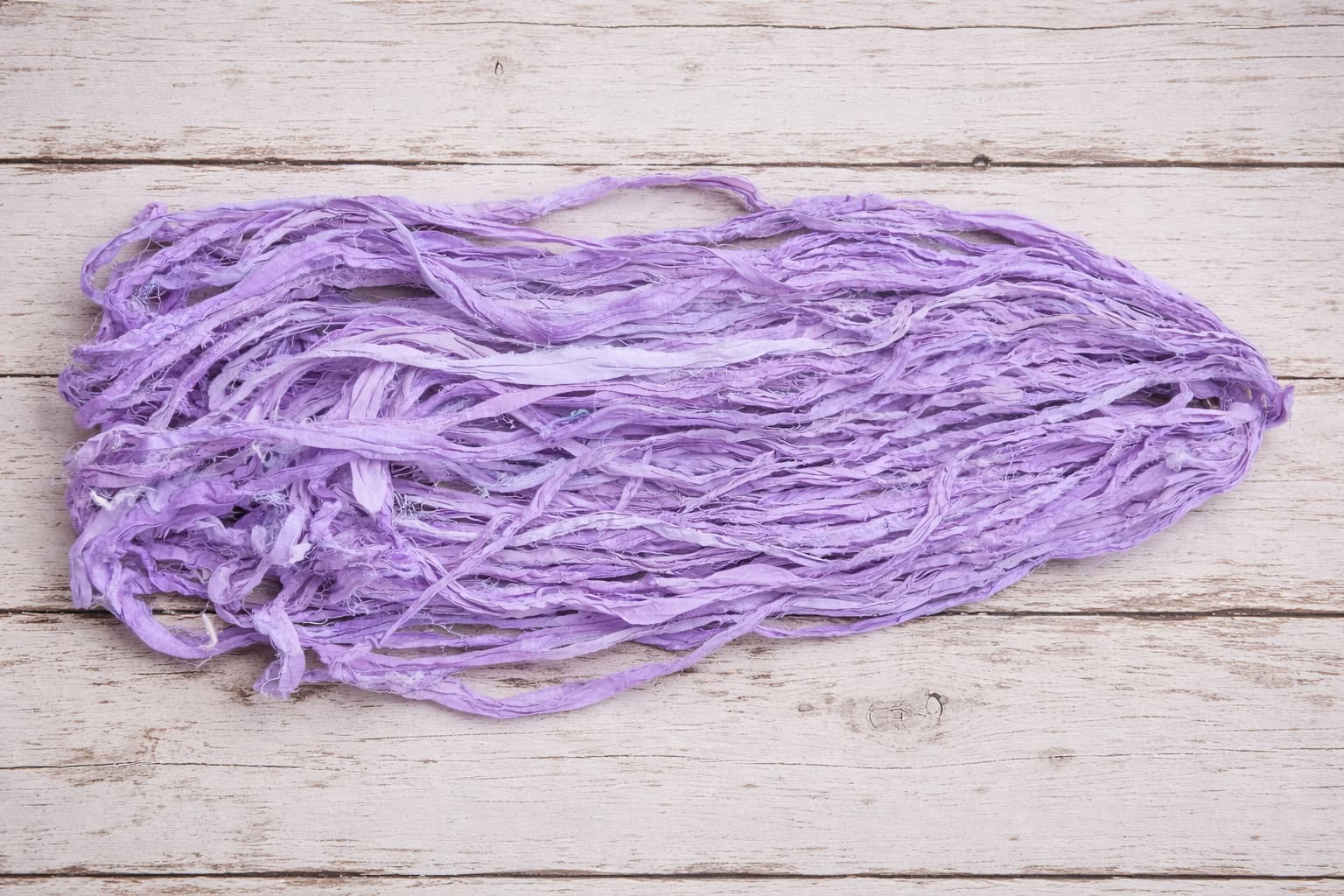 Lavender sari silk ribbon showing natural texture and frayed edges