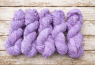 Multiple skeins of lavender sari silk ribbon