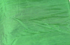 Close-up of Spring Green Dupion Silk Fabric showing natural slub texture, woven silk detail, and fresh vibrant green colour