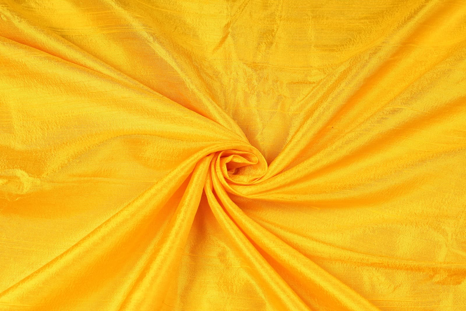 Golden Yellow Dupion Silk Fabric arranged in elegant swirling folds highlighting its luminous sheen, crisp texture, and vibrant golden colouring