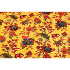 Deep yellow hand-printed cotton velvet with red and orange floral design – flatlay