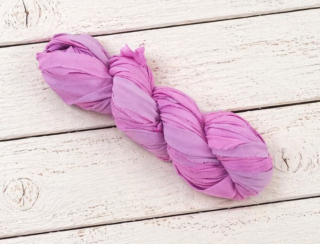 Single skein of Orchid Blossom chiffon silk ribbon yarn in orchid pink color