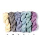 Mercerized Cotton Yarn – six shades in ivory, gray, blue, and lavender tones, soft 100% cotton skeins.
