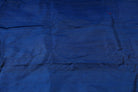 Midnight Blue Dupion Silk Fabric displayed in flowing folds showing its rich colour and luxurious silk sheen