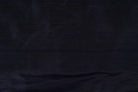 Close-up of Deep Navy Dupion Silk Fabric showing natural slub texture, woven silk detail, and subtle tonal variation