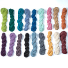 Assorted Nettle Yarn – hand-spun Himalayan fiber in 18 earthy and colorful shades on white background