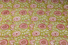 Olive Blossom block printed cotton fabric showing repeating floral pattern on olive green background