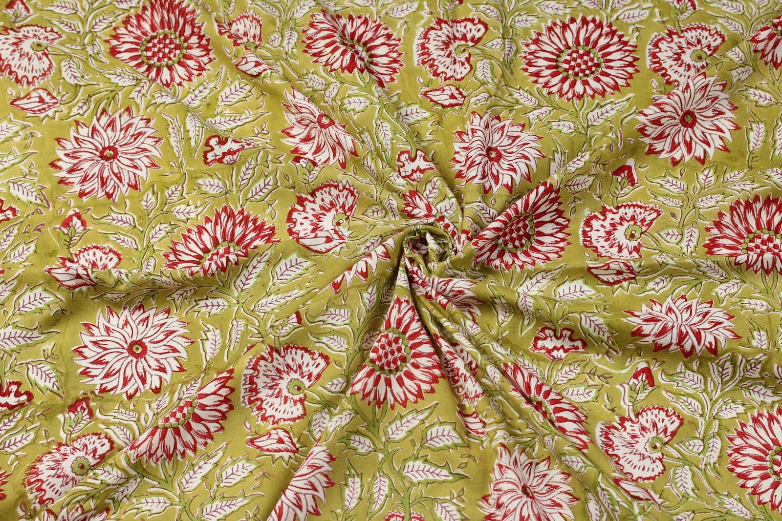 Olive Blossom block printed cotton fabric draped to show softness and movement