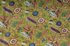 Close-up of Olive Woodland Wildflower fabric showing bell flowers, blue blooms, berries, leaves, and hand block printed botanical details