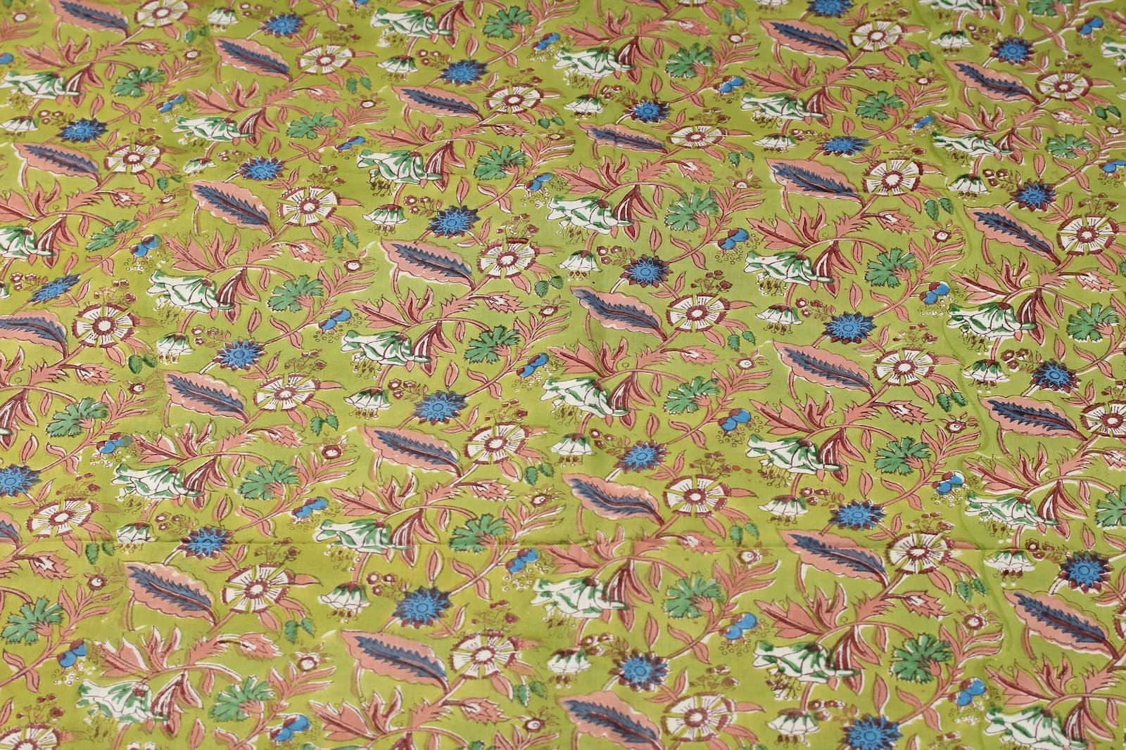 Olive Woodland Wildflower hand block printed cotton fabric featuring botanical flowers, berries, and trailing vines on an olive green background