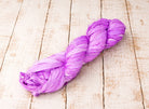 Single orchid sari silk ribbon skein in a soft pastel purple shade.