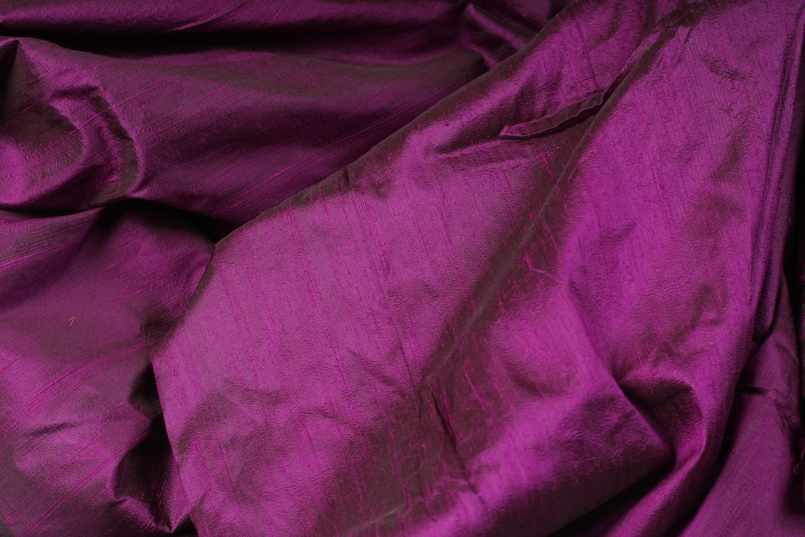 Close-up of Orchid Purple Dupion Silk Fabric showing natural slub texture, woven silk detail, and vibrant orchid-purple tones