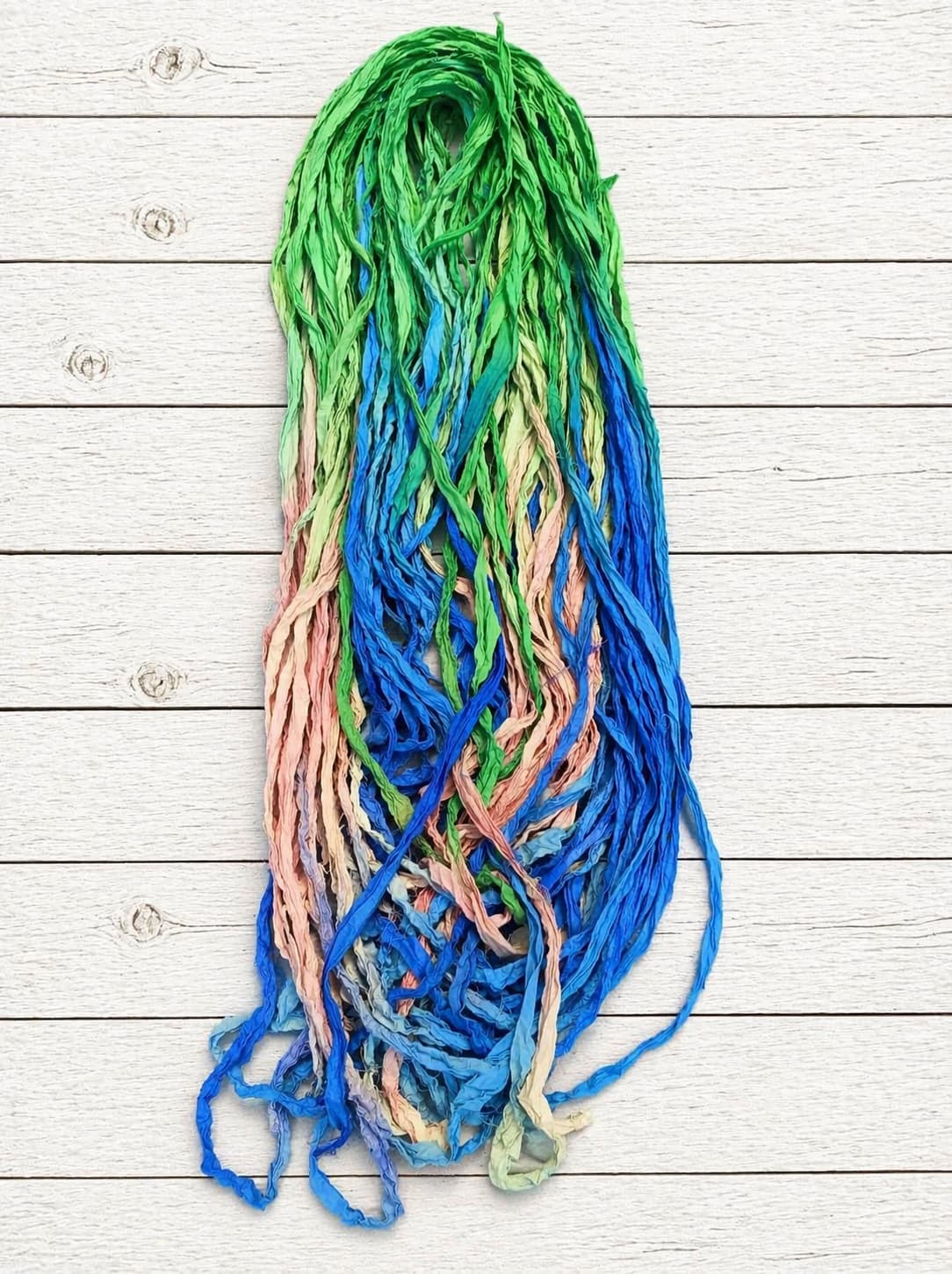 Seaside Garden recycled sari silk ribbon yarn in ocean blue, seafoam green and blush pink tones