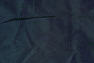 Close-up of Peacock Blue Dupion Silk Fabric showing natural slub texture, iridescent colour variation, and woven silk detail