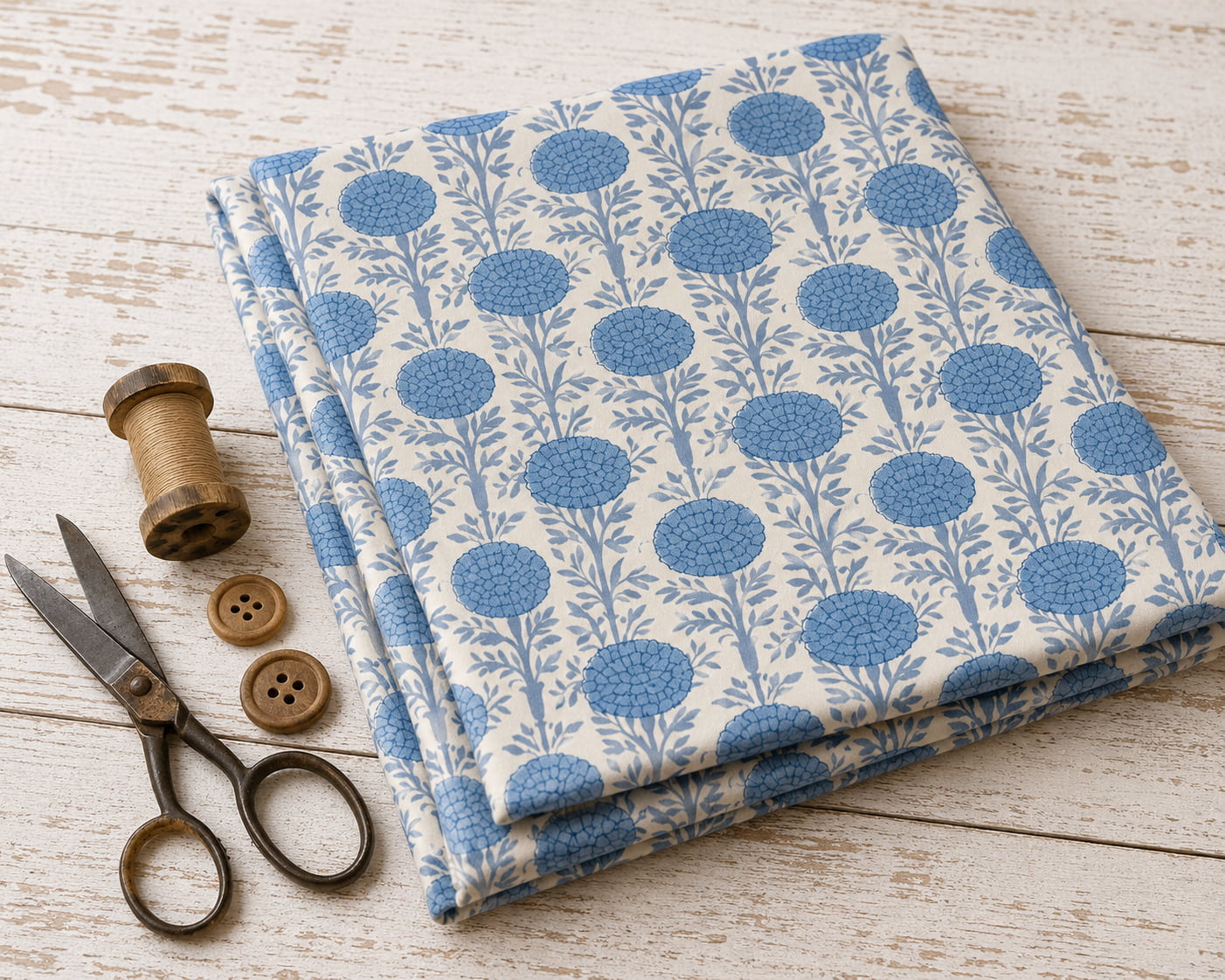Powder blue block printed cotton fabric folded for sewing and quilting projects