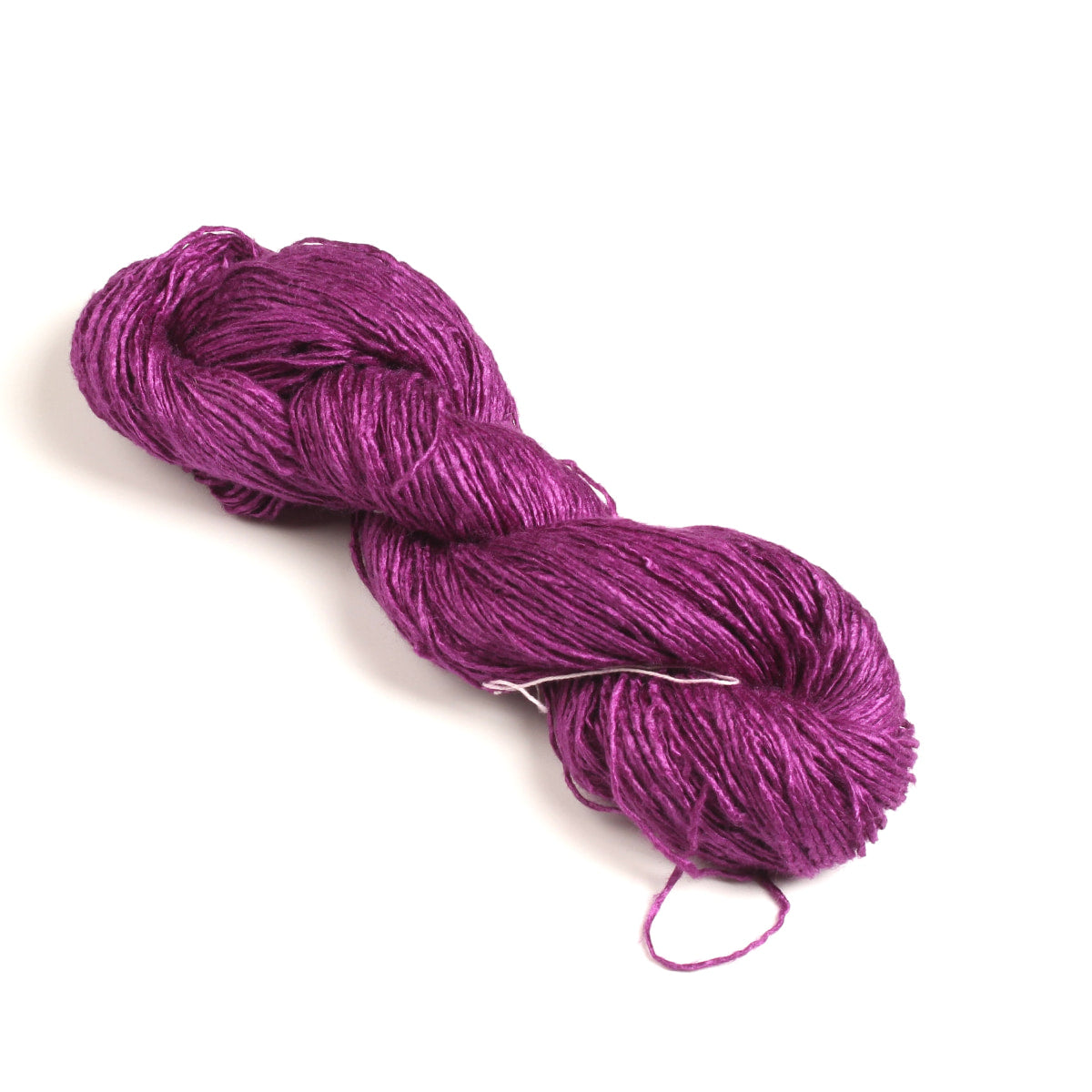Handspun purple Eri silk yarn on white background – eco-friendly peace silk yarn