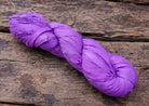 Single violet sari silk ribbon skein in a vibrant purple shade.