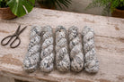 Newsprint recycled sari silk ribbon skein for weaving and textile art