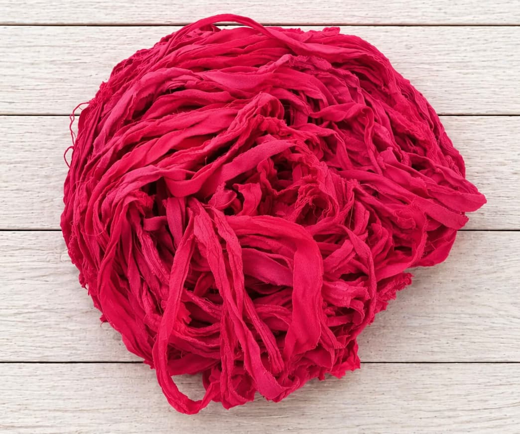 Coiled Ruby Fuchsia recycled sari silk ribbon yarn