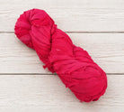 Single skein of Ruby Fuchsia recycled sari silk ribbon yarn