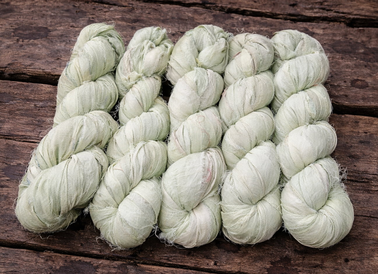 Multiple skeins of Sage Mist sari silk ribbon