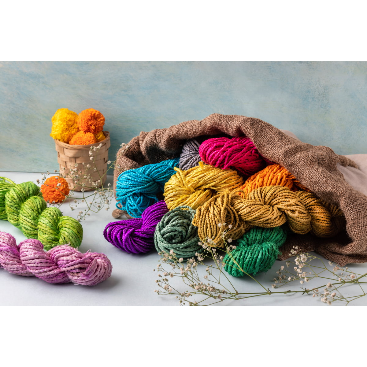 Twisted sari silk ribbon cords in assorted colors on flat lay for crafts and jewelry making