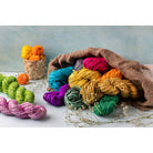 Twisted sari silk ribbon cords in assorted colors on flat lay for crafts and jewelry making
