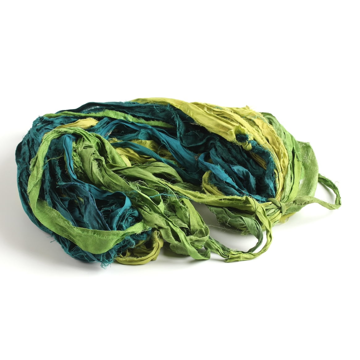 Green sari silk ribbon in multiple shades displayed open, showing frayed edges and recycled silk texture.