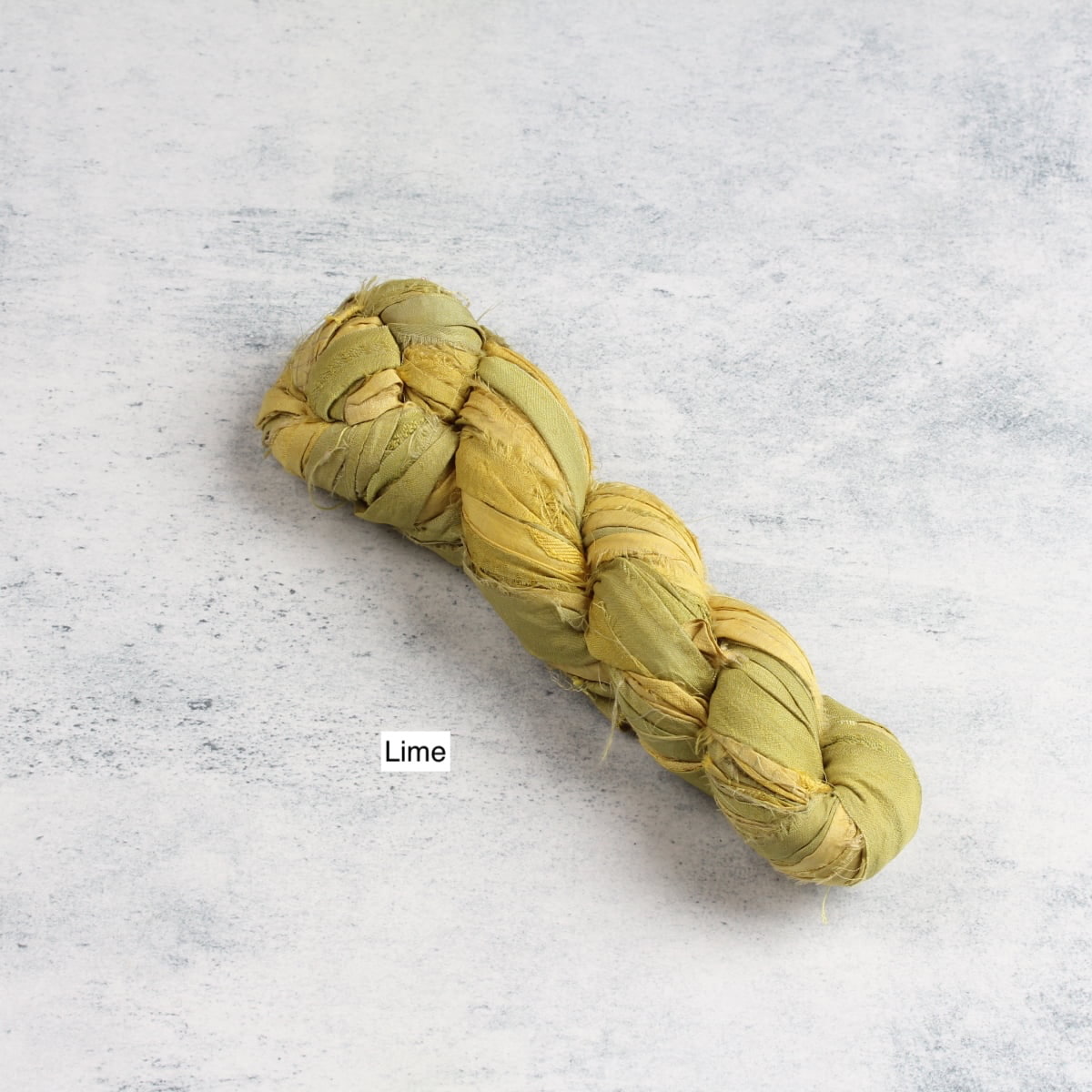 Lime green sari silk ribbon made from recycled sari silk for creative projects