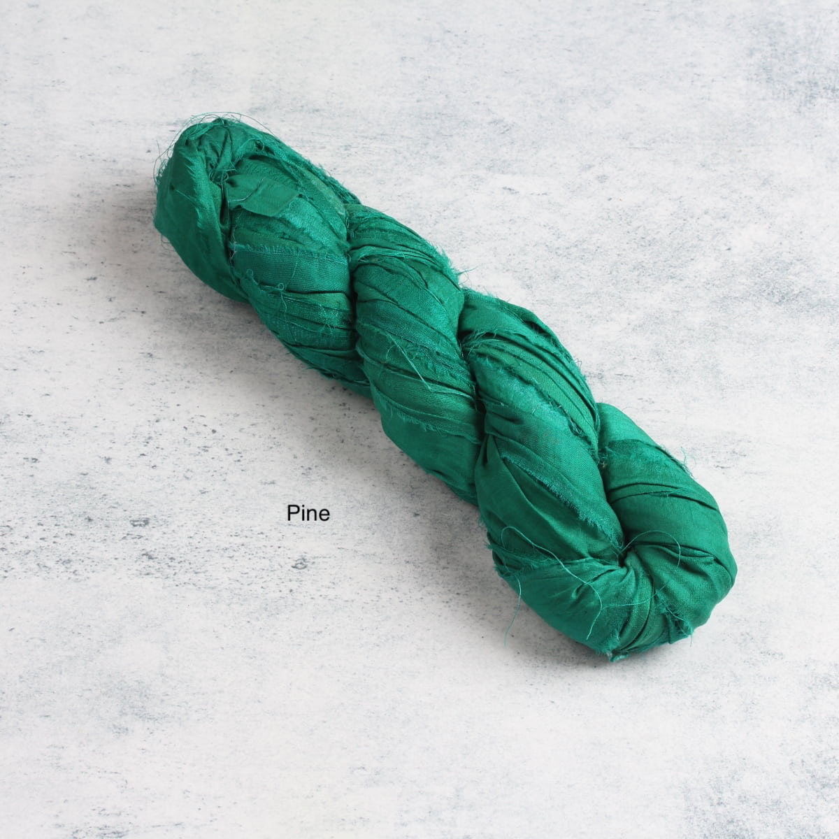 Pine green sari silk ribbon skein – deep forest recycled silk for sewing and gift wrapping