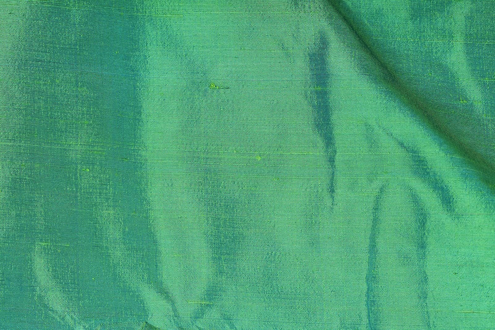 Close-up of Seafoam Green Dupion Silk Fabric showing natural slub texture, woven silk detail, and subtle colour variation