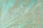 Seafoam Aqua Shot Dupion Silk Fabric draped to show lustre and texture