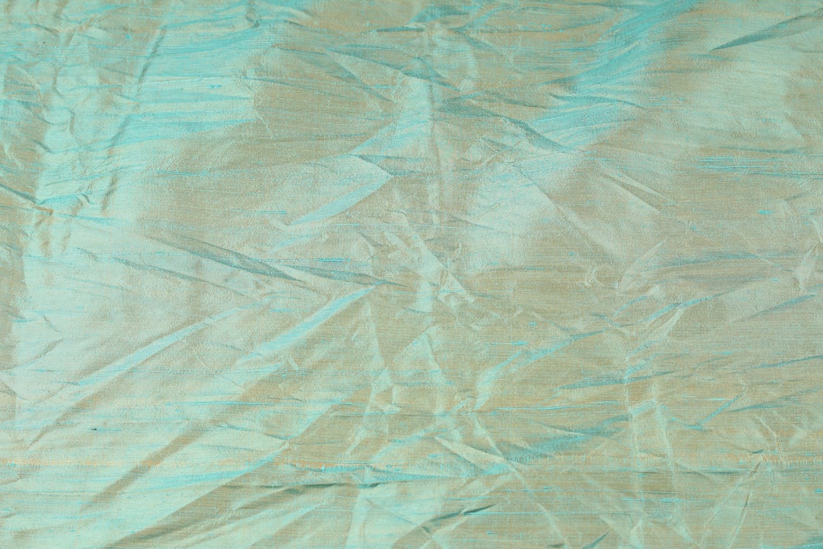 Seafoam Aqua Shot Dupion Silk Fabric draped to show lustre and texture