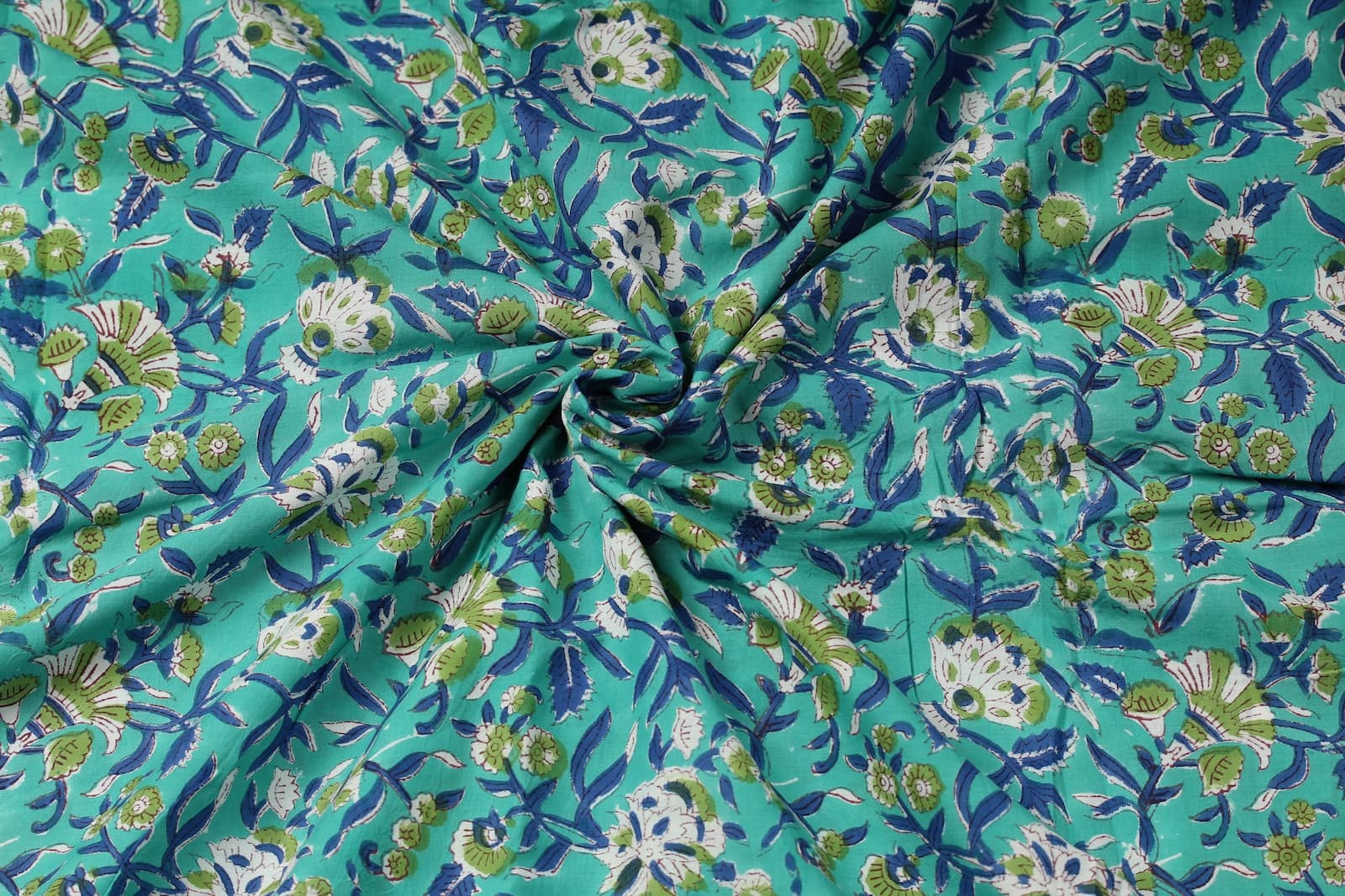 Seafoam Wildflower Trail floral block print cotton fabric gathered to showcase drape, texture, and pattern detail