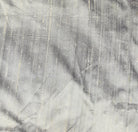 Close-up of Silver Pewter dupion silk fabric showing metallic silver colour, natural raw silk texture, and characteristic slubs