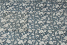 Slate Meadow Bloom hand block printed cotton fabric featuring ivory floral vines and botanical motifs on a slate blue background