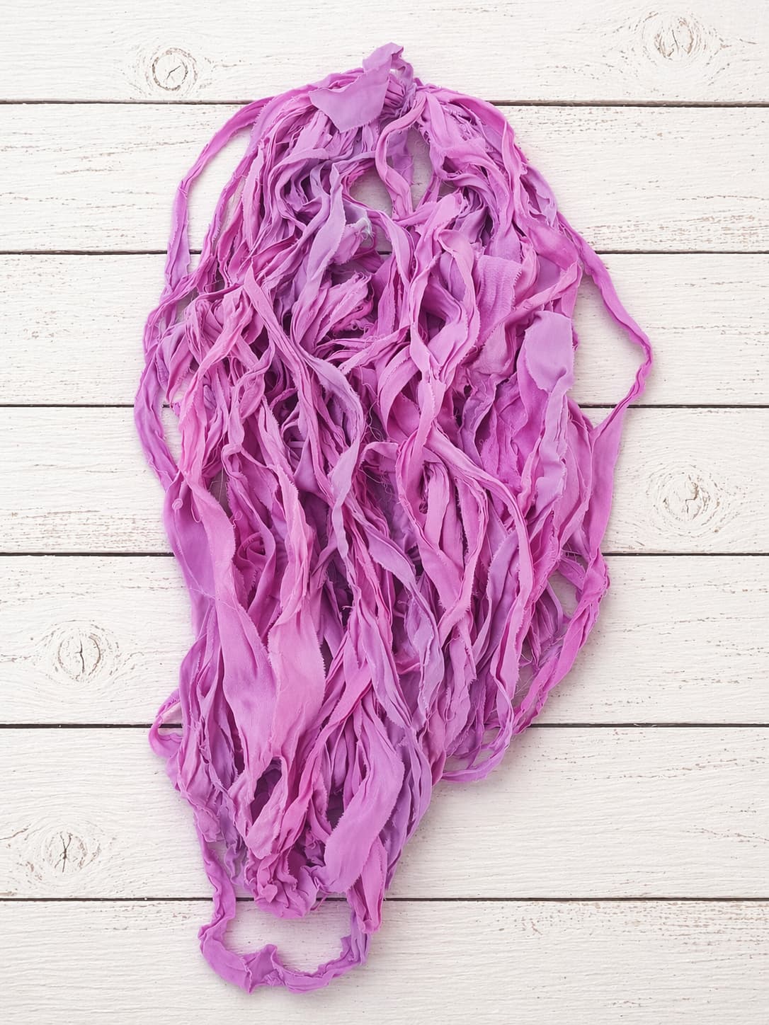 Close-up of Orchid Blossom chiffon silk ribbon yarn highlighting soft chiffon texture and orchid pink tones