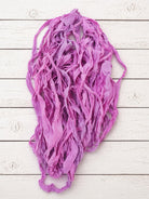 Close-up of Orchid Blossom chiffon silk ribbon yarn highlighting soft chiffon texture and orchid pink tones