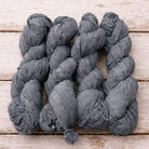 Bundle of storm grey sari silk ribbon skeins crafted from recycled sari silk.