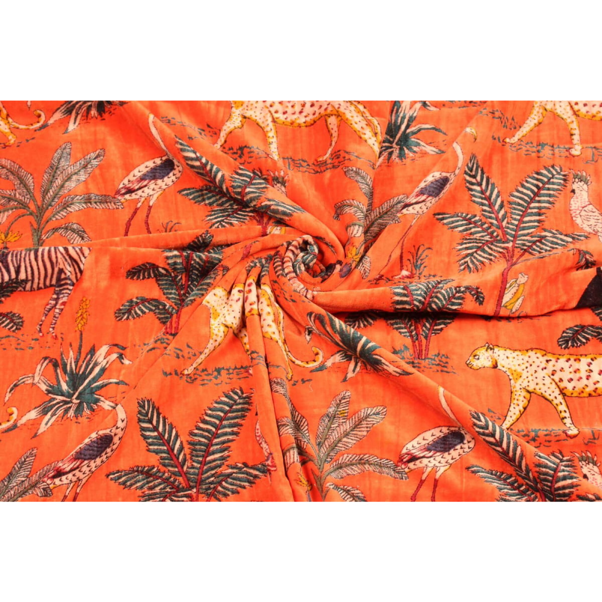 Folded orange velvet showing luxurious texture and jungle print details