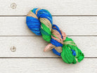 Single skein of Seaside Garden recycled sari silk ribbon yarn for weaving and crochet